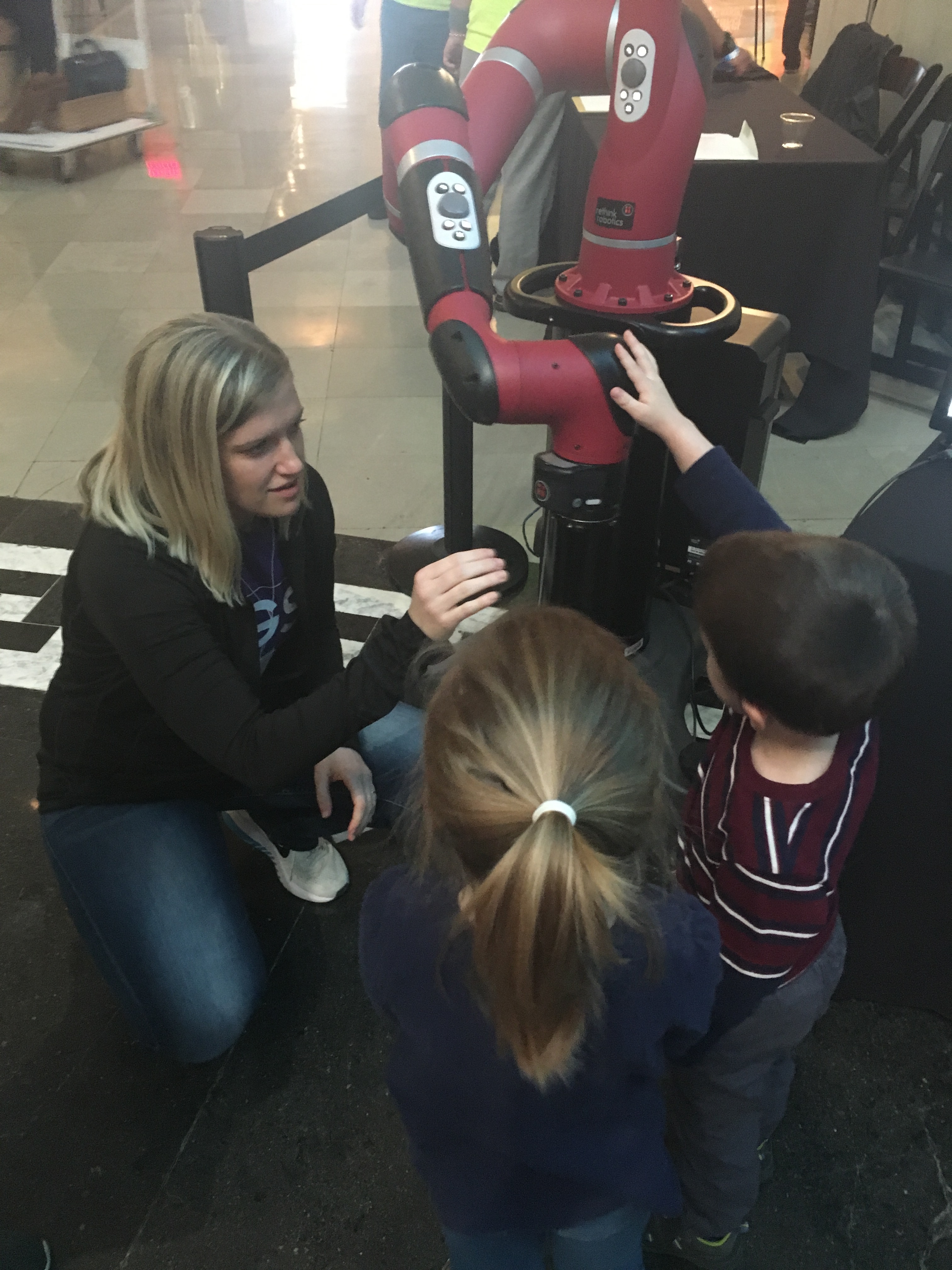 Katie Fitzsimons demonstrating human-robot interaction at the Museum of Science and Industry